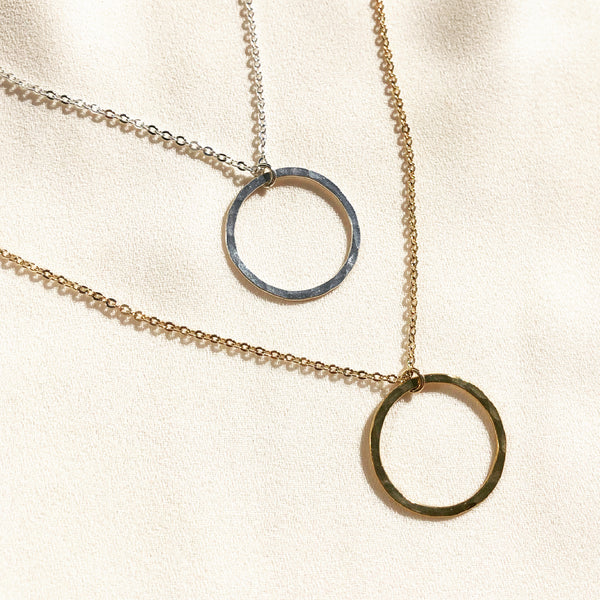 open circle necklaces, symbolizing wholeness and completeness