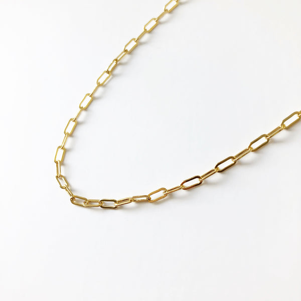 14k gold filled, paper clip chain necklace on a white background