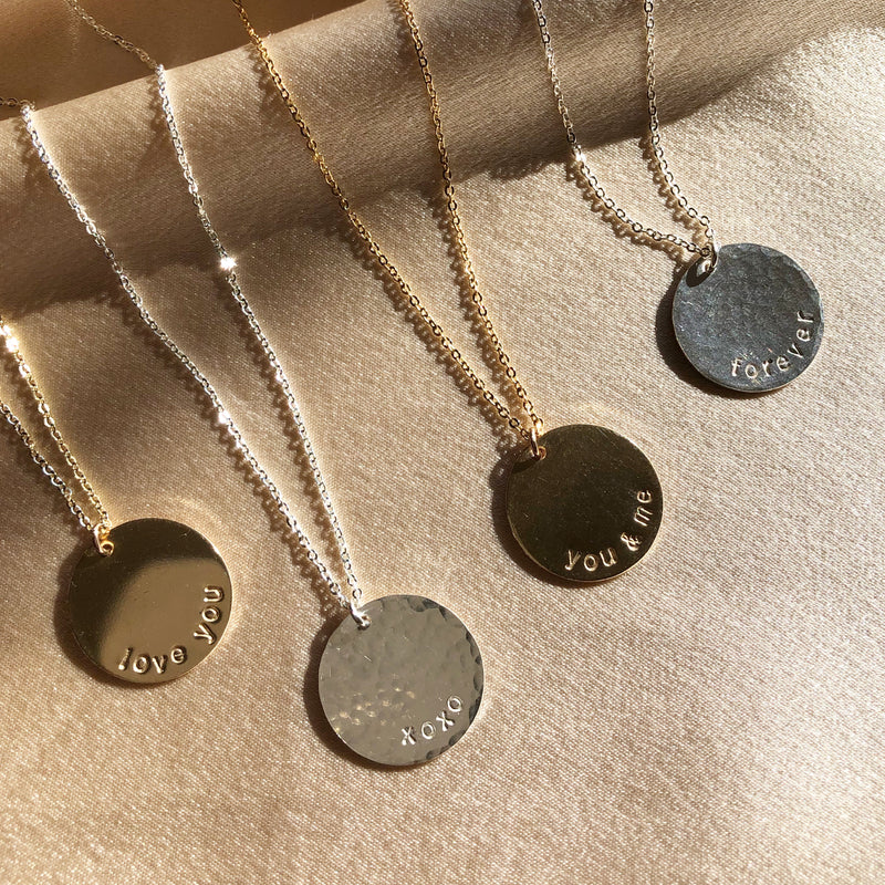 sterling silver and gold filled, handstamped custom discs necklaces with different Valentines Day sayings on them  
